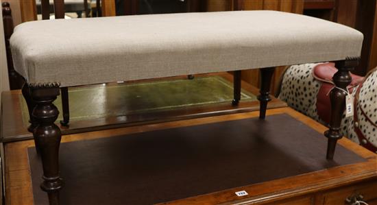 An upholstered stool, W.100cm